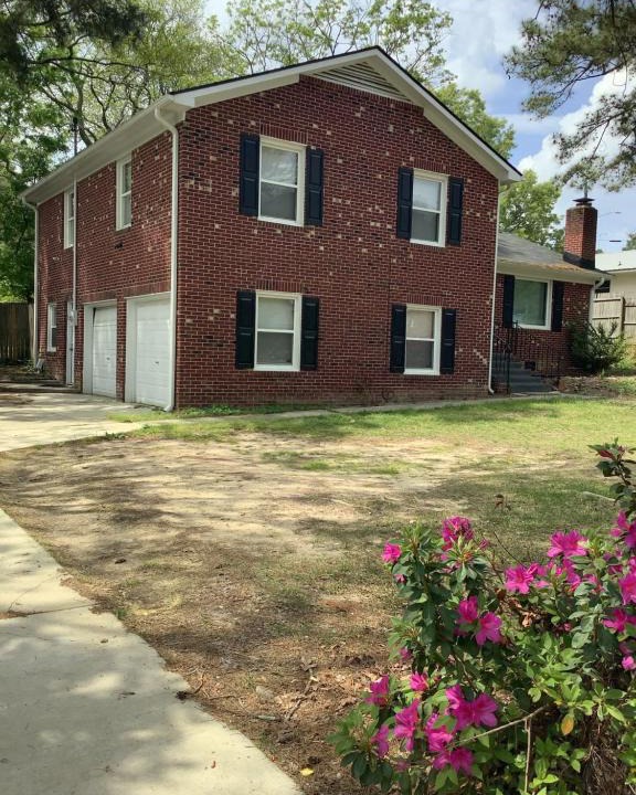 Terry Sanford House | 4-bedroom brick home with a full kitchen, king size bed and all the space you need for you and your large family on your getaway.