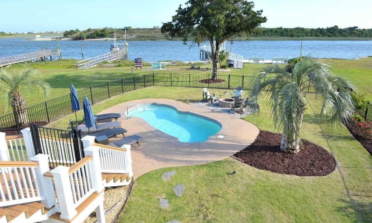 Shallotte House | Beautiful ICW views! Private pier, pool, hot tub, fire pits, and more!