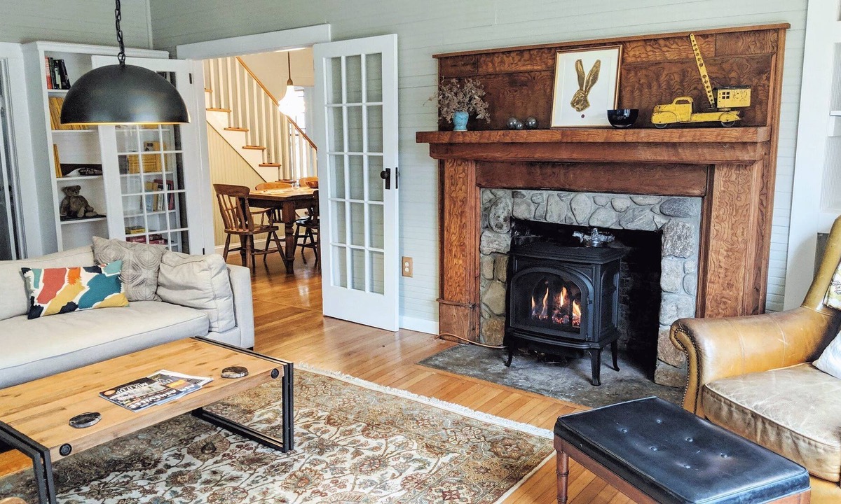 Burnsville House | Creekside Iconic Yellow Farmhouse with firepit
