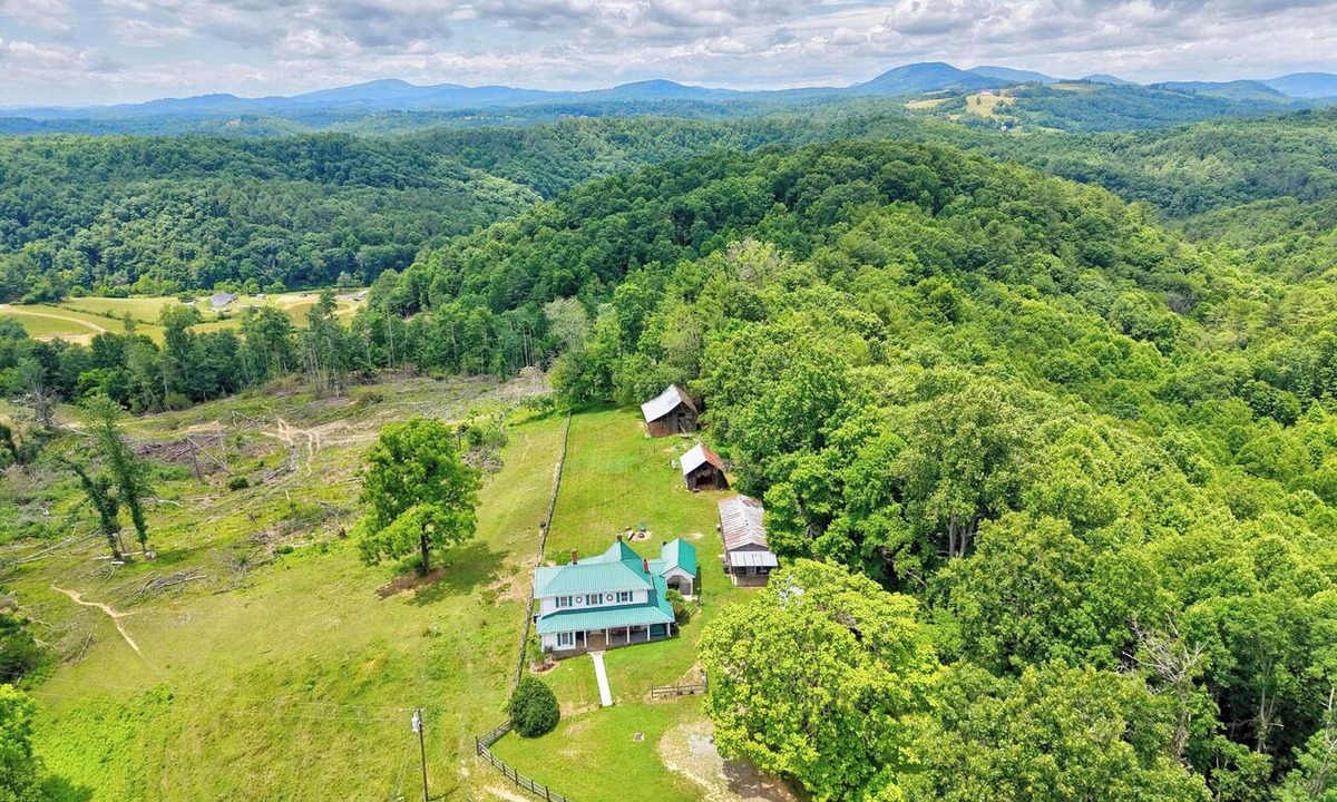 Galax House | Escape to this spacious countryside retreat featuring beautiful mountain views, a wraparound porch.