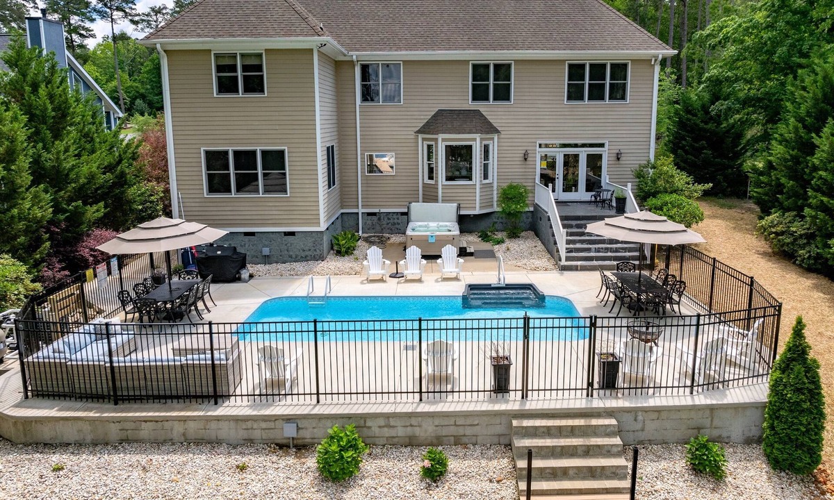 Halifax County House | 🌅 Lakefront Luxury | Flat Lot, Heated Pool, Hot Tub & Game Room Fun 🎮 Dock!