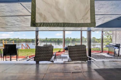 Augusta House | Luxury Riverfront Escape~Pool~BoatSlip~Kayaks~BBQ