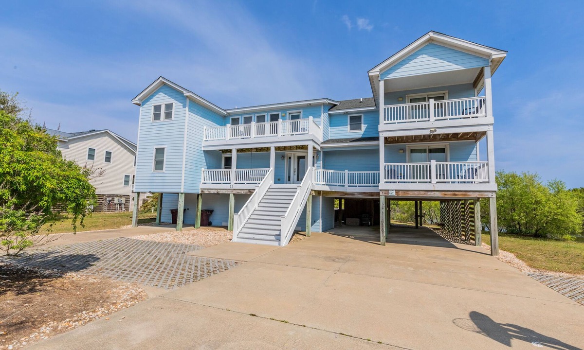 Southern Shores House | Peaceful lakefront views with private saltwater pool, large scale living, and wonderful amenities