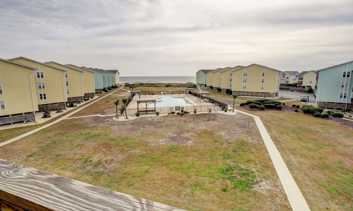 Surf City Condo | Top Floor Condo with Loft - Pool and Ocean Views!