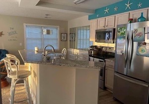 Beautiful condo overlooking the 8th hole on Magnolia course,lagoon with turtles.