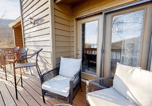 Lakefront condo with wood-burning fireplace, WiFi, two decks, & great views