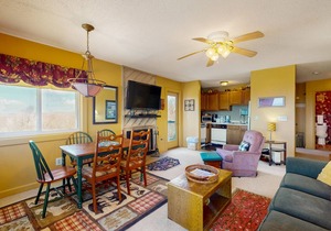 Mountain-view condo with hot tub, pool, high-speed WiFi & wood-burning fireplace