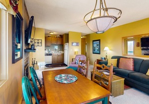 Mountain-view condo with hot tub, pool, high-speed WiFi & wood-burning fireplace