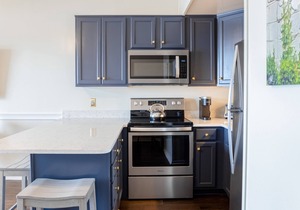 Riverfront condo with USS North Carolina view, balcony, central AC, and w/d