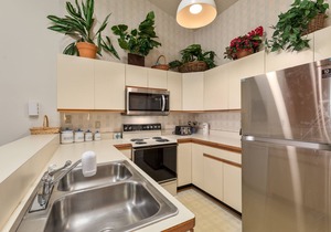 Sea Dunes condo with community pool and tennis, beach access, porch swing, baby gate, and WiFi
