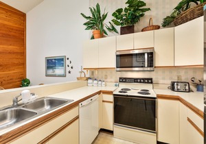 Sea Dunes condo with community pool and tennis, beach access, porch swing, baby gate, and WiFi