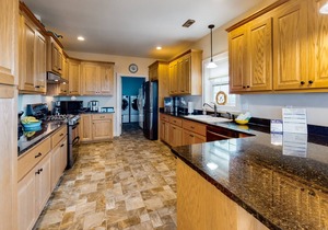 Welcoming home with screened porch, outdoor shower, elevator & central AC