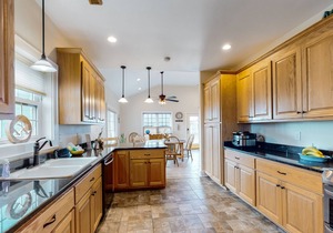 Welcoming home with screened porch, outdoor shower, elevator & central AC