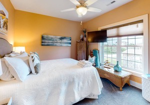 Welcoming home with screened porch, outdoor shower, elevator & central AC