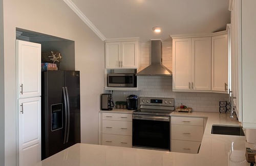 Ocean Isle Beach House | Canal/w dock, pool, ocean view, 1 block from beach & EV charger