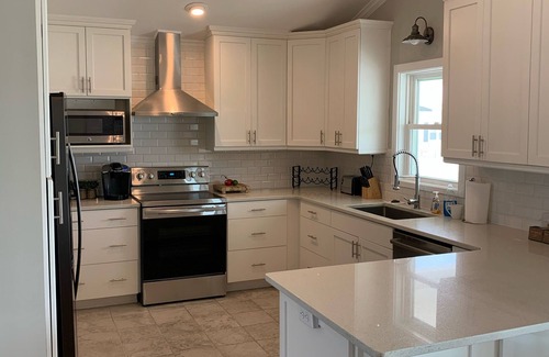 Ocean Isle Beach House | Canal/w dock, pool, ocean view, 1 block from beach & EV charger