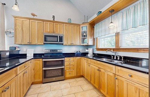 Wind Over Waves House | Incredible two-story home with private pool, hot tub, & game room