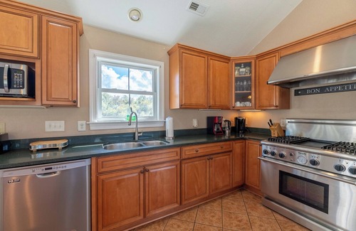 Sea Scape House | K0029 Show Boat scenic rental with pool, hot tub, and golf course views