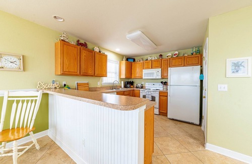 Colington Harbour House | K1552 BeachBumz- Canalfront! Community Pool! Private Dock!