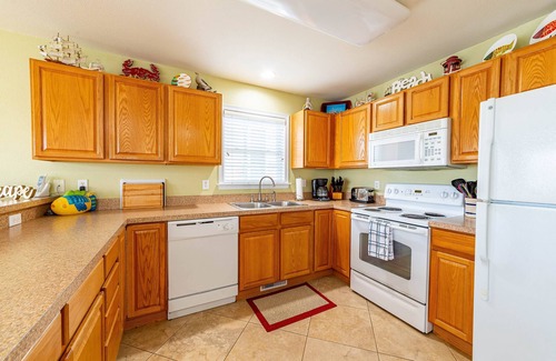 Colington Harbour House | K1552 BeachBumz- Canalfront! Community Pool! Private Dock!
