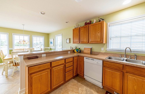 Colington Harbour House | K1552 BeachBumz- Canalfront! Community Pool! Private Dock!