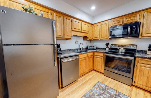 Lake Lure Condo | Lakefront condo with wood-burning fireplace, WiFi, two decks, & great views