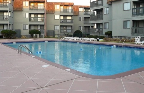 Morehead City Condo | Ocean-side condominium with pool. Fully-equipped for relaxed vacationing.