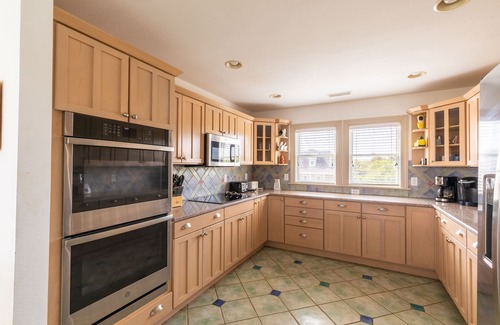 Southern Shores House | Peaceful lakefront views with private saltwater pool, large scale living, and wonderful amenities