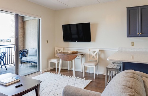 Wilmington Historic District Condo | Riverfront condo with USS North Carolina view, balcony, central AC, and w/d