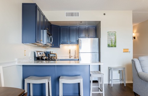 Wilmington Historic District Condo | Riverfront condo with USS North Carolina view, balcony, central AC, and w/d