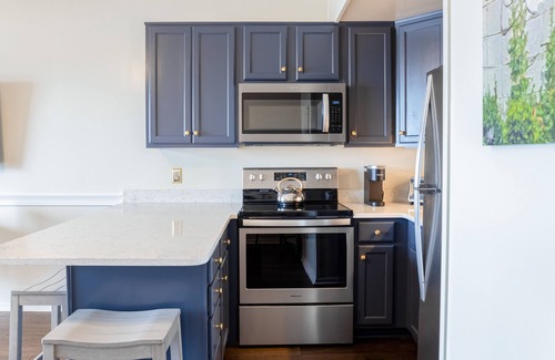 Wilmington Historic District Condo | Riverfront condo with USS North Carolina view, balcony, central AC, and w/d