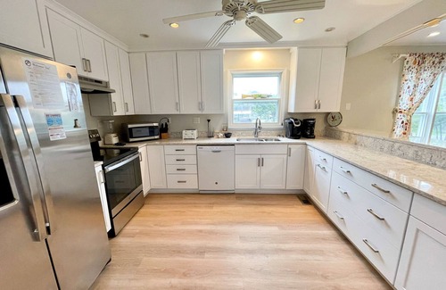 Ocracoke House | Spindrift: Spacious dog friendly canal front home, dock, decks, views