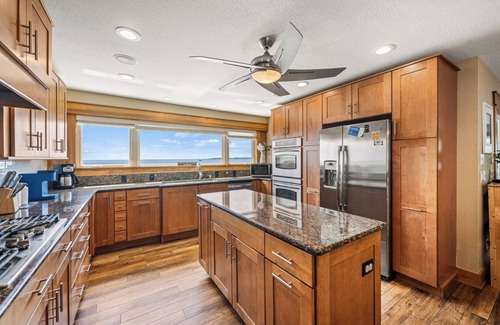 Colington House | Sunset Bay 5 Bedroom Home with a Jacuzzi Tub, Work-Out Room and Bayside Access!