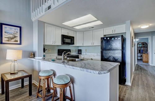 Surf City Condo | Top Floor Condo with Loft - Pool and Ocean Views!