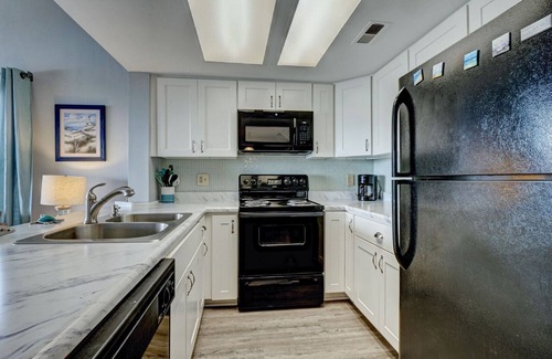 Surf City Condo | Top Floor Condo with Loft - Pool and Ocean Views!