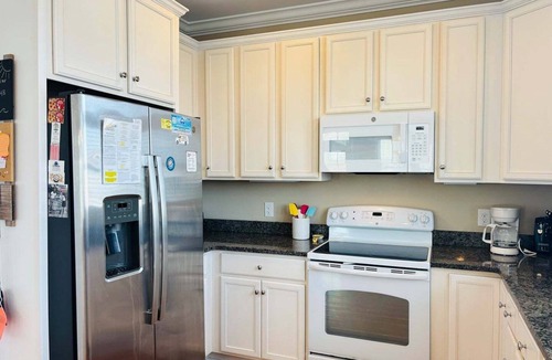 Holden Beach House | 1 Fine Day, a 4BR oceanfront retreat in Holden Beach, sleeps 10 with stunning views.