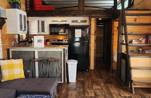Mill Spring House | 2-story tiny home nestled on the creek, quick walk to pool and playground, private firepit, sleeps 7.