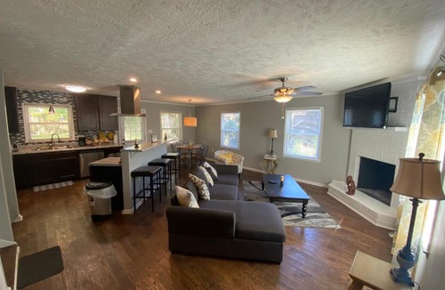 Terry Sanford House | 4-bedroom brick home with a full kitchen, king size bed and all the space you need for you and your large family on your getaway.