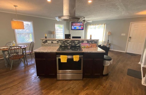 Terry Sanford House | 4-bedroom brick home with a full kitchen, king size bed and all the space you need for you and your large family on your getaway.