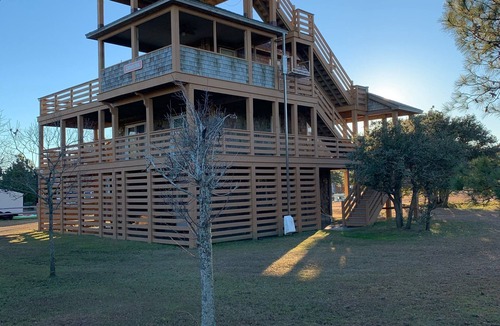 Carova Beach House | 4X4 only! Canal front. Ocean AND sound views! Decks and porches on all levels.