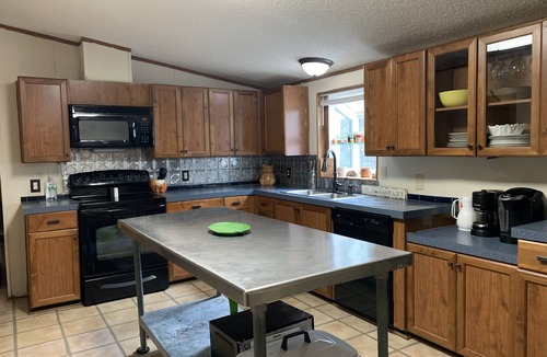 Roxboro House | 5 bdrm, 3 full bth, large living room and fireplace area.