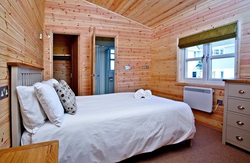 St Merryn Cabin | A light and spacious lodge with one double with walk in wardrobe and ensuite shower and one twin.