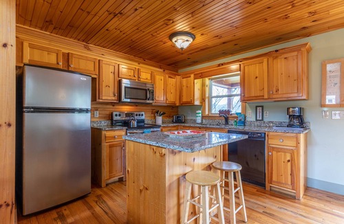 Todd Cabin | Andrews River Haven - River Front with hot tub-Cozy, Fun for Kids, Pet Friendly!