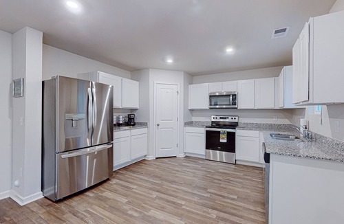 St. James House | Beach and Golf Retreat: Coastal home with community pool, close to beach and local attractions!