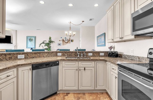 Yaupon Beach Condo | Beats Working: Condo with Community Pool Near OKI Pier and Restaurants