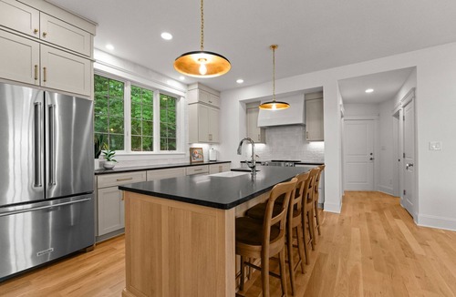 Denver House | Beautiful 5 Bedroom Lake-Front Home with Heated Saltwater Pool, Spa, and Dock