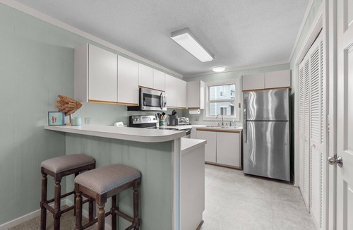 Ocean Sands Condo | Beautifully decorated condo in Corolla with community pool outside!