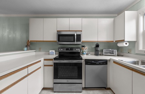 Ocean Sands Condo | Beautifully decorated condo in Corolla with community pool outside!