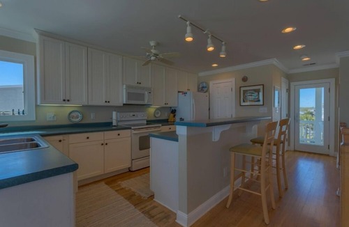 Holden Beach House | Bee Holden - Enjoy the beautiful Atlantic ocean from the deck while relaxing on the porch swing