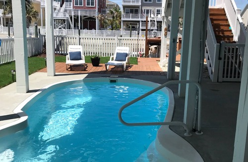 Ocean Isle Beach House | Canal Front w/Putting Green w/private dock & private heated pool; Sleeps 18+
